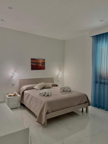 Ένα ή περισσότερα κρεβάτια σε δωμάτιο στο Luxury Magre