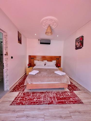 Hotel L'Arganier d'Ammelneにあるベッド