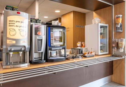 a kitchen with two coffee machines on a counter at B&B HOTEL Yvetot in Yvetot