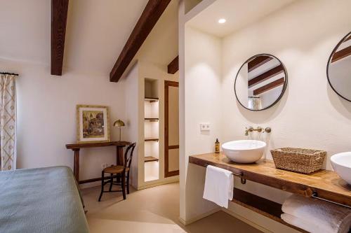 a bathroom with a sink and a mirror at Son Seriol in Inca