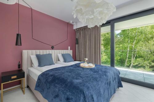 Un pat sau paturi într-o cameră la Sea&Lake Stylish Apartment with Air Conditioning and Parking near the beach in Mielno by Noclegi Renters