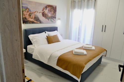 Ένα ή περισσότερα κρεβάτια σε δωμάτιο στο Eve's Central Comfort Apartment #1