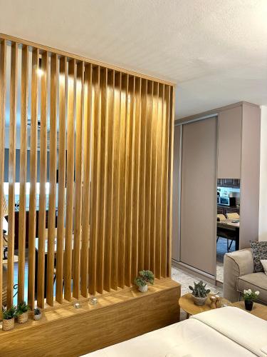 a living room with a large wooden wall at Tinos Boutique House in Tinos