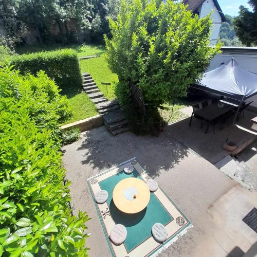 a backyard with a pool table and a piano at Villa Sabic in Sarajevo
