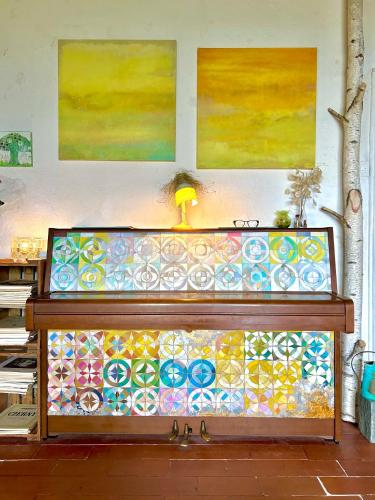 a counter with stained glass on it with paintings at B&B Casa Codega in Intragna