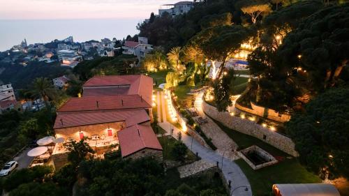 an overhead view of a building with lights in a park at Chateau Du Comte 