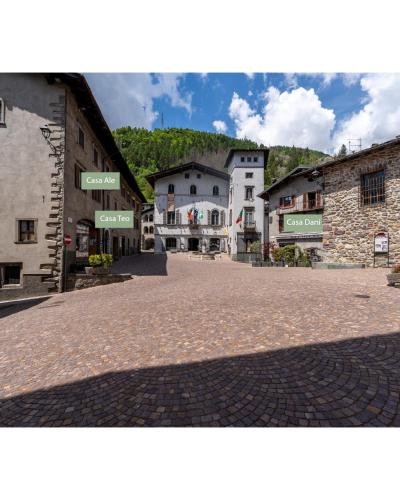a cobblestone street in a town with buildings at Dagli Olivari - Casa Ale in Gromo