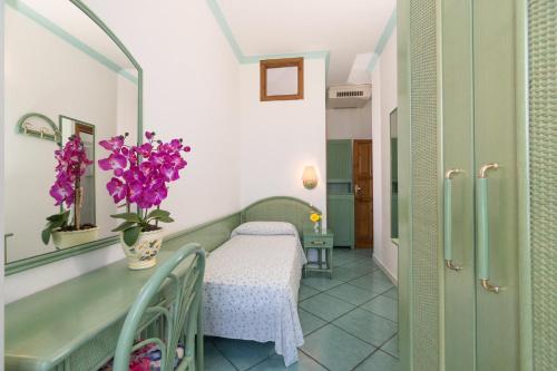 Кровать или кровати в номере Hotel Casa del Sole