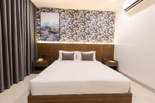 Ένα ή περισσότερα κρεβάτια σε δωμάτιο στο One Budget Hotel