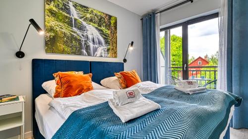 Posteľ alebo postele v izbe v ubytovaní Apartament Szmaragdowy w Karpatia - 5D Apartamenty