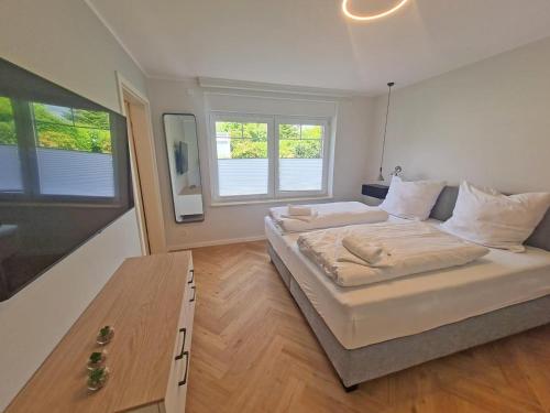 Postel nebo postele na pokoji v ubytování Wilde Brise 3 – Luxusbungalow in bester Lage in Norddeich