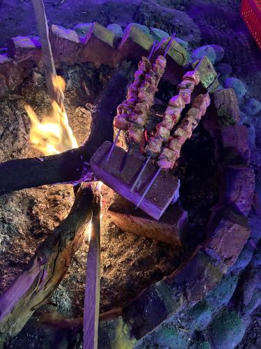 a grill with some food on top of it at Byway, Kasol in Manīkaran