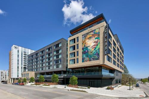 a building with a large mural on the side of it at Hotel Celare, Cincinnati Midtown, a Tribute Portfolio Hotel in Cincinnati
