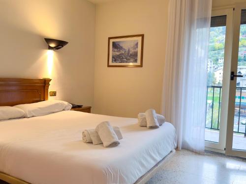 Una cama o camas en una habitación de Hotel Pere D'Urg 3000