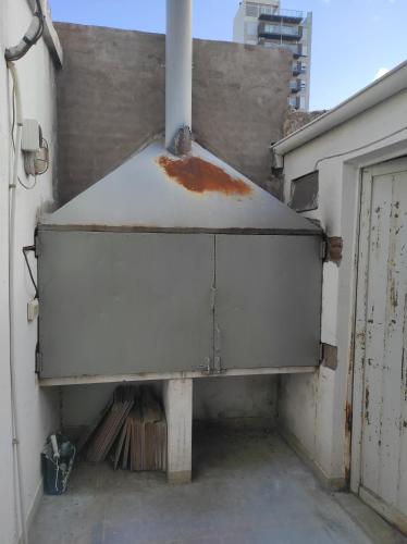 a large white object on the side of a building at Depto Centrico en Planta Alta in Bahía Blanca