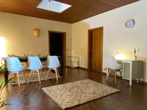 a dining room with blue chairs and a table at 150 m 5-room Villa 15 min to Düsseldorf in Kaarst