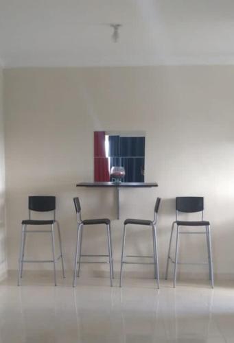 a group of four chairs in a room at Hermoso Apartamento Turístico in Colorado