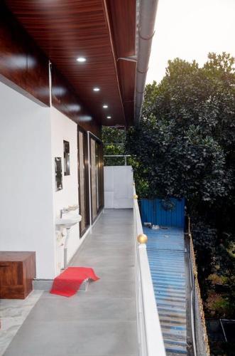 a hallway of a house with a red rug at Appa's Rain Hill Villa in Thane