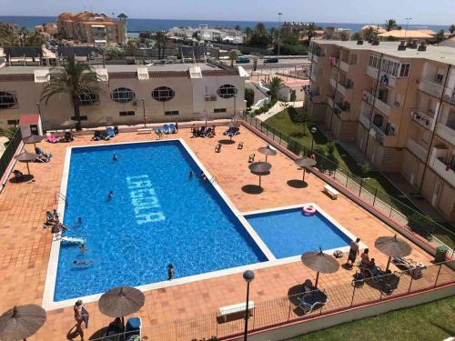 an overhead view of a swimming pool in a building at Apartamento Jacuzzi La Manga - Primera Linea in La Manga del Mar Menor