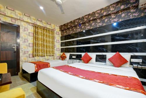 Katil atau katil-katil dalam bilik di Airport Hotel Classic Paradise