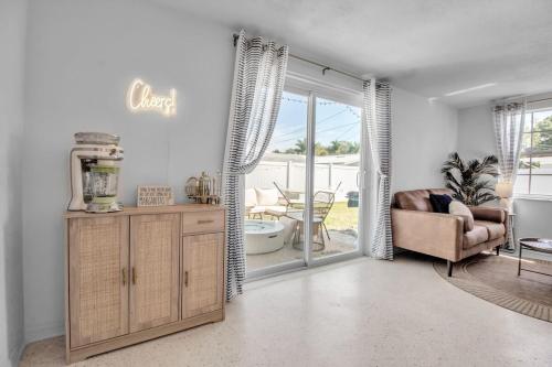 a living room with a couch and a chair at Madeira Beach Family & Pet Friendly Luxury Getaway in Seminole