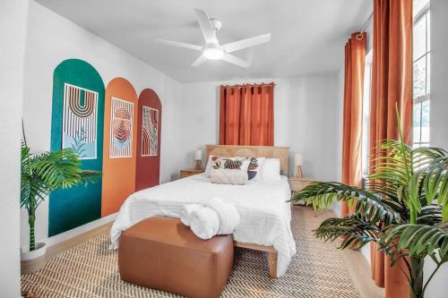 a bedroom with a bed and surfboards on the wall at Madeira Beach Family & Pet Friendly Luxury Getaway in Seminole