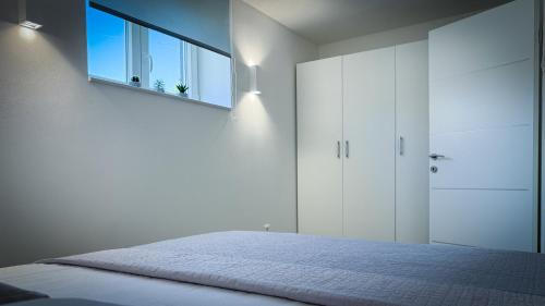 Katil atau katil-katil dalam bilik di Apartments Roberta