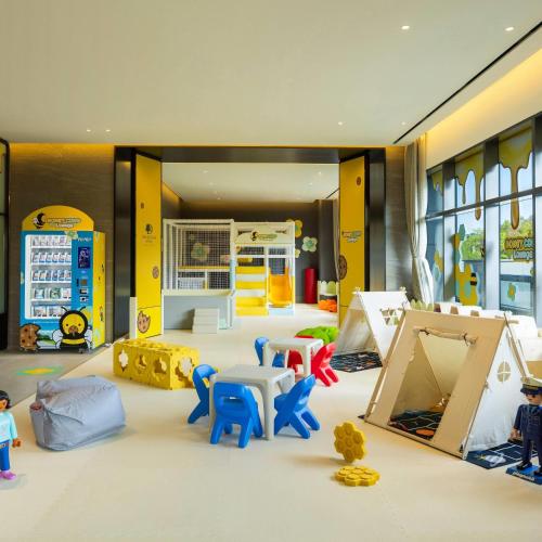a play room with toys and a table and chairs at DoubleTree By Hilton Seoul Pangyo in Seongnam