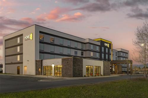 a rendering of a hotel building with a sunset at Home2 Suites By Hilton Bozeman Four Corners in Bozeman