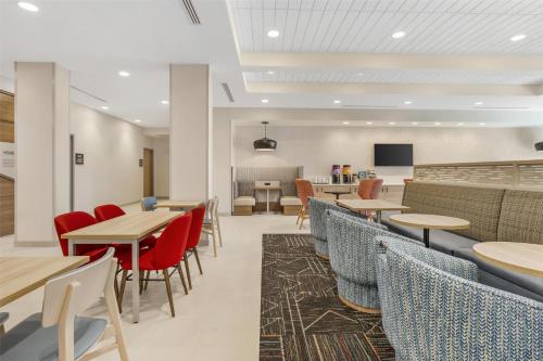 a dining room with tables and chairs at Home2 Suites By Hilton Bozeman Four Corners in Bozeman