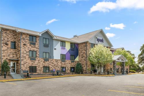 a rendering of the front of a hotel with a parking lot at Spark By Hilton Eden Prairie in Eden Prairie