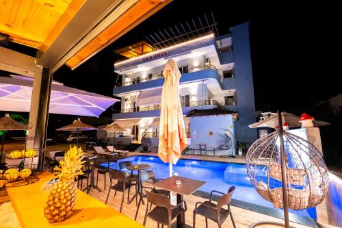 a pool on the side of a cruise ship at night at Vila ZOGAJ in Ksamil