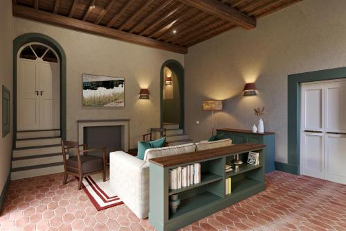 a living room with a couch and a fireplace at Villa Gamberaia in Settignano