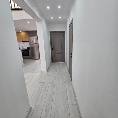 an empty hallway of a house with a kitchen at Casablanca in Kaji-Say