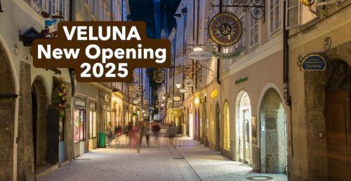 a street with a sign that reads vienna new opening at VELUNA Salzburg One in Salzburg