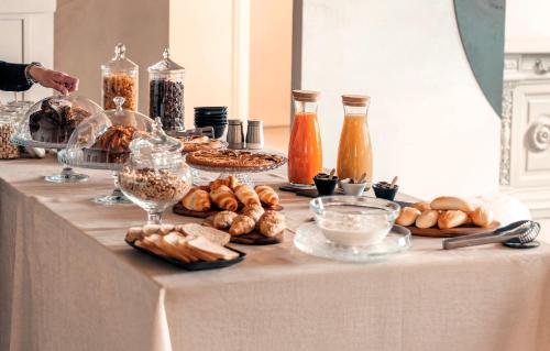 a table with a bunch of different types of food at Borgo del Lago in San Gemini