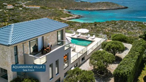 an aerial view of a house with a swimming pool at Seacrete villas in Chania
