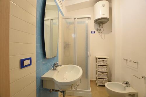 a bathroom with a sink and a shower at Mediterranean View in Marina di Ragusa