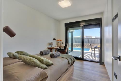 Ένα ή περισσότερα κρεβάτια σε δωμάτιο στο Villa Dorada del Roque