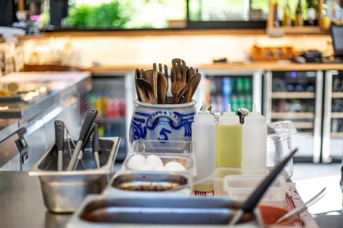 a counter top with a vase filled with food at Ullensvang Gjesteheim in Lofthus