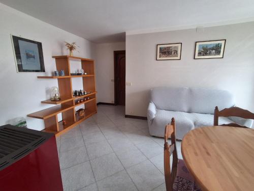 a living room with a couch and a table at Bella vista in Castellino Tanaro
