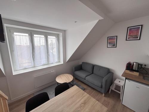 Η κουζίνα ή μικρή κουζίνα στο Logements centre Bourg