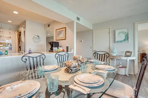 a dining room with a glass table and chairs at St Helena Island Condo - half Mi to Beach in Oceanmarsh Subdivision