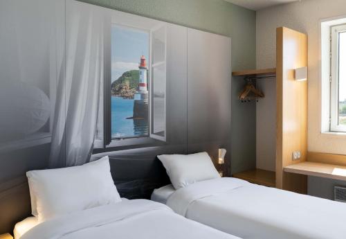 Postel nebo postele na pokoji v ubytování B&B HOTEL Lorient Caudan