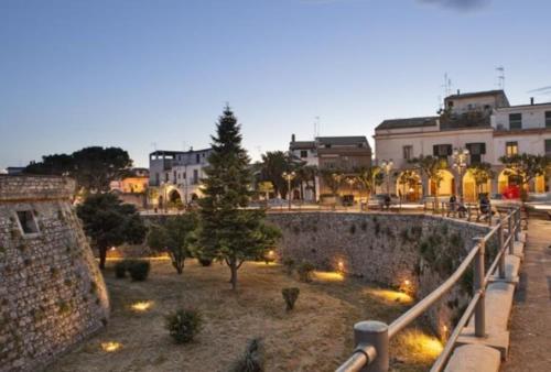 a view of a city at night with buildings at Miky M House in Venosa