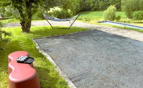 a hammock sitting on the side of a road at DOMAINE DE LEJOS - Portes d'Albi in Lamillarié