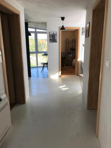 a hallway of a house with white walls and floors at Holiday house Anna in Veli Iž