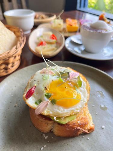 a fried egg on a piece of bread on a plate at Pousada Picinguaba in Ubatuba