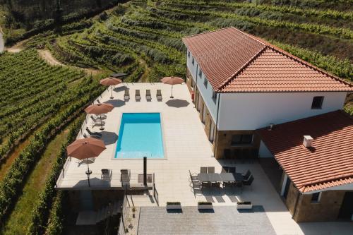 an aerial view of a house with a swimming pool at Casa do Tojo (Camélias de Basto - Turismo Rural) in Pedras Alvas