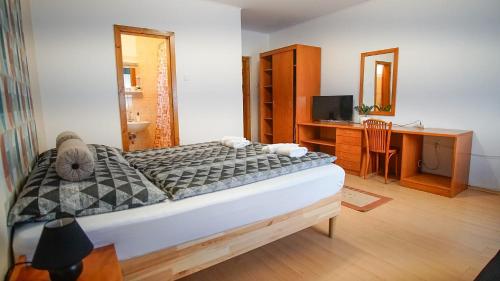 Postel nebo postele na pokoji v ubytování Zam-Zem Holiday Apartman